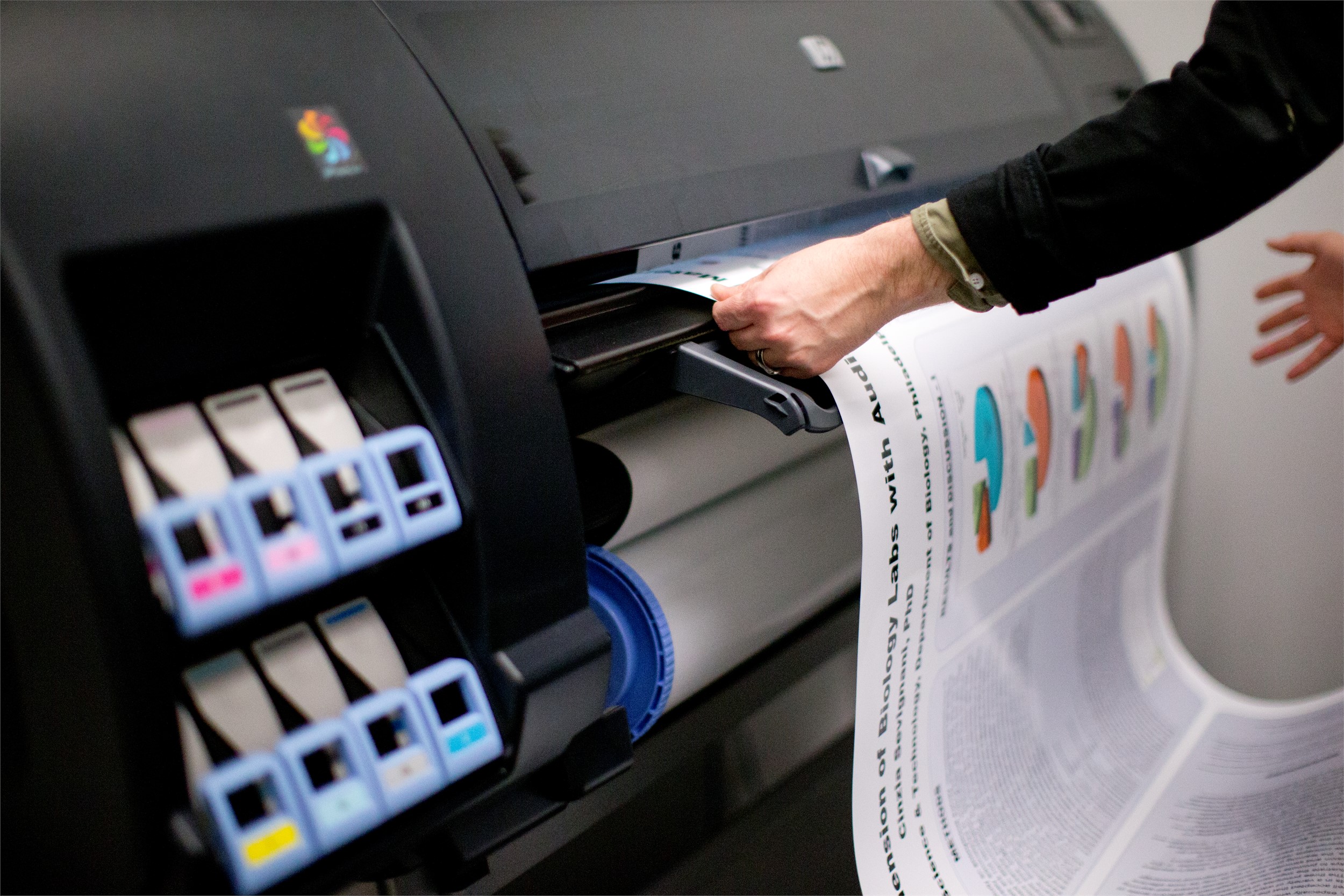 Specialized Printer in the TECH Center printing a poster
