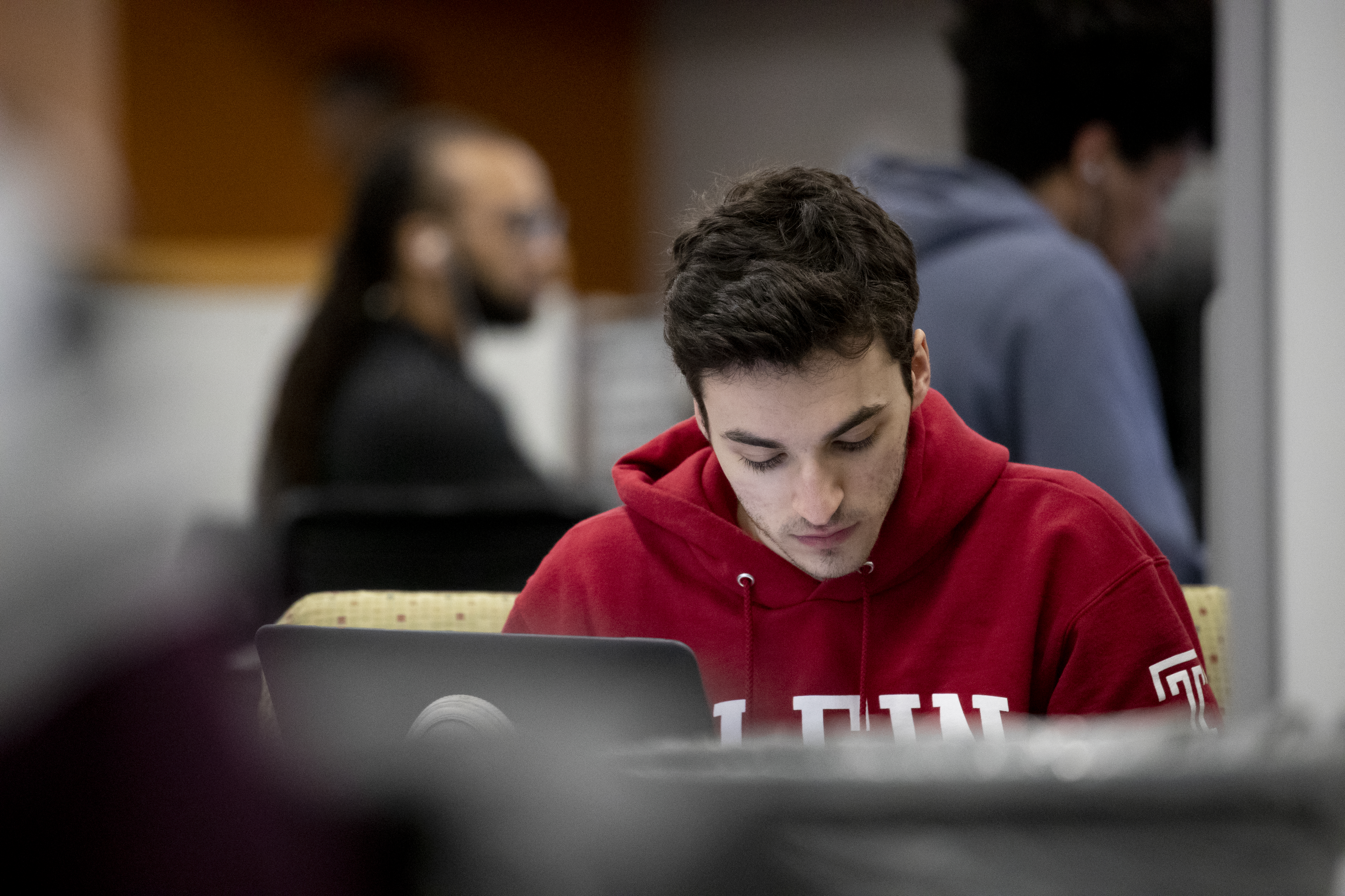 Student working on laptop in TECH Center
