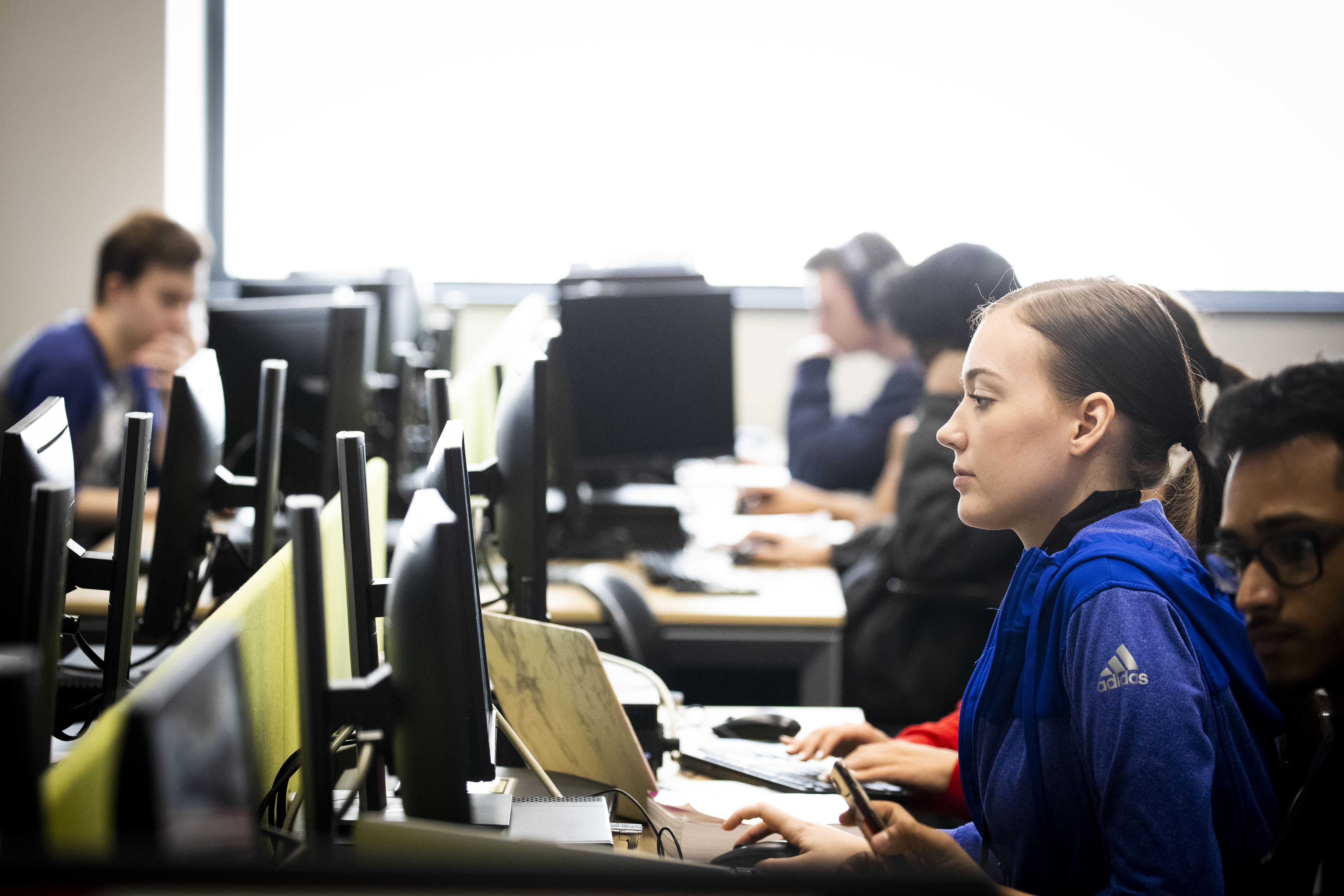 Students working on computer workstations in Tuttleman Computer Lab