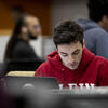 Student working on laptop in TECH Center